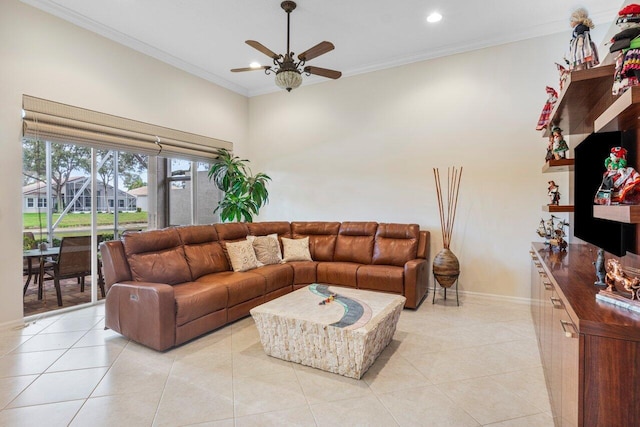 living room with light tile patterned floors, ceiling fan, and ornamental molding