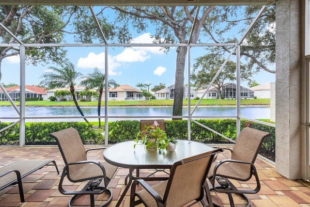 sunroom with a water view