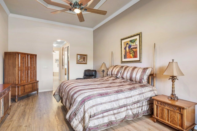 bedroom with crown molding, wood-type flooring, and ceiling fan