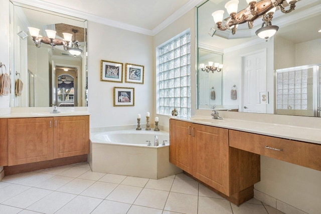 bathroom with vanity, a washtub, crown molding, and tile patterned flooring