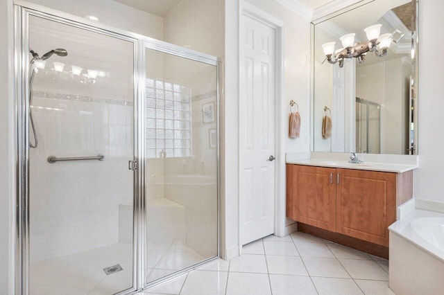 bathroom with tile patterned floors, vanity, ornamental molding, and separate shower and tub