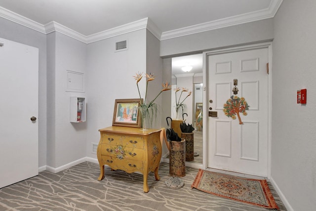 foyer featuring ornamental molding