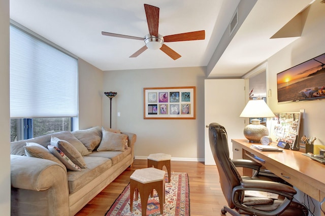 office space with ceiling fan and light wood-type flooring