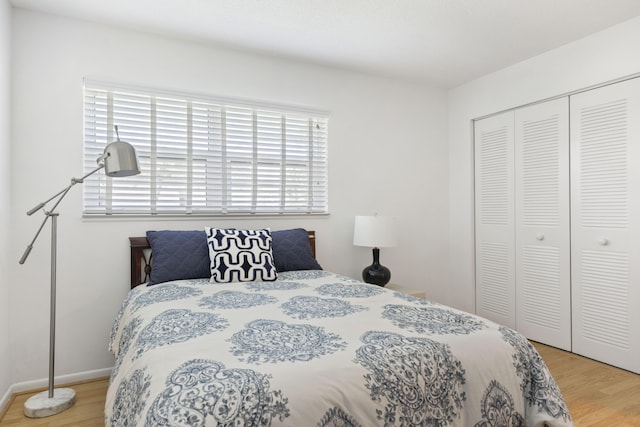 bedroom featuring a closet and hardwood / wood-style flooring