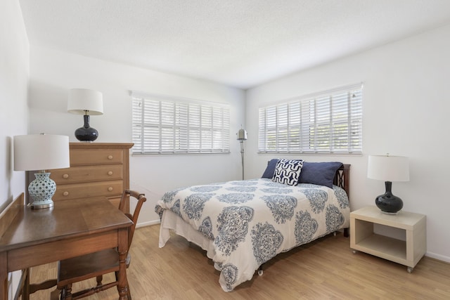 bedroom featuring light wood-type flooring