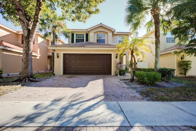 mediterranean / spanish-style house featuring a garage