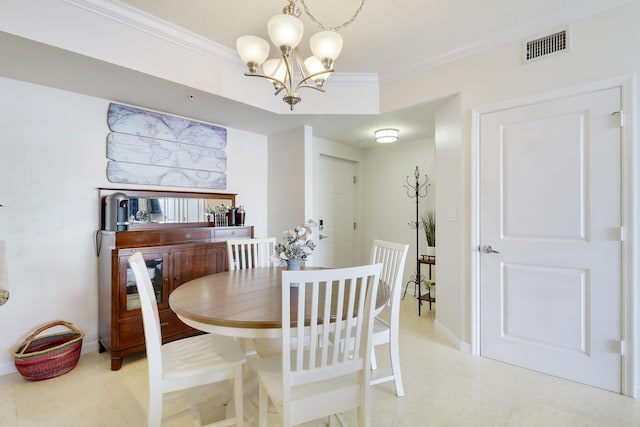 dining area with a chandelier and ornamental molding