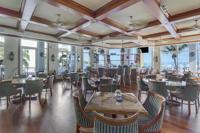 dining space featuring coffered ceiling, beam ceiling, and dark hardwood / wood-style flooring