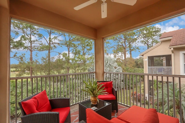 sunroom with ceiling fan and a healthy amount of sunlight