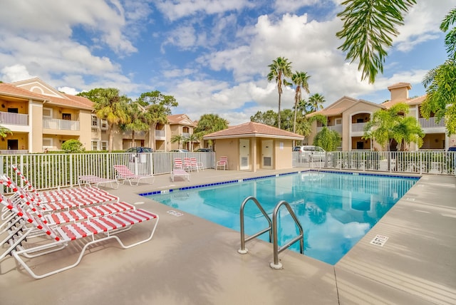 view of swimming pool with a patio