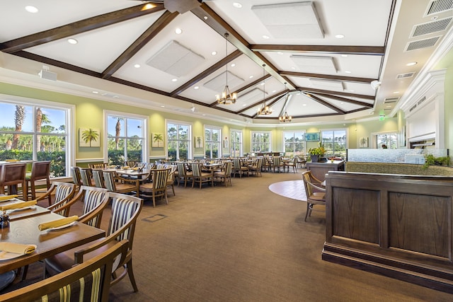 interior space featuring high vaulted ceiling, ornamental molding, beamed ceiling, and an inviting chandelier