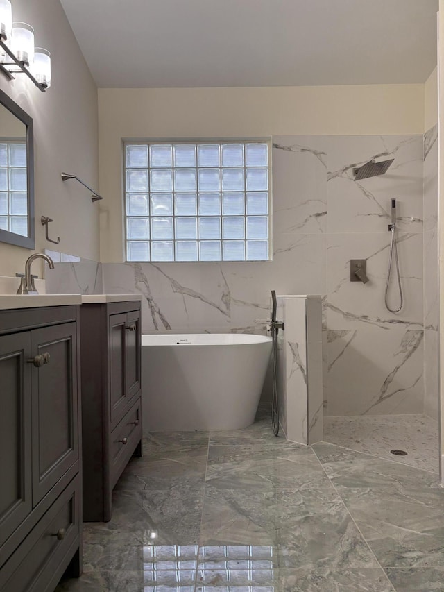 bathroom featuring vanity and shower with separate bathtub