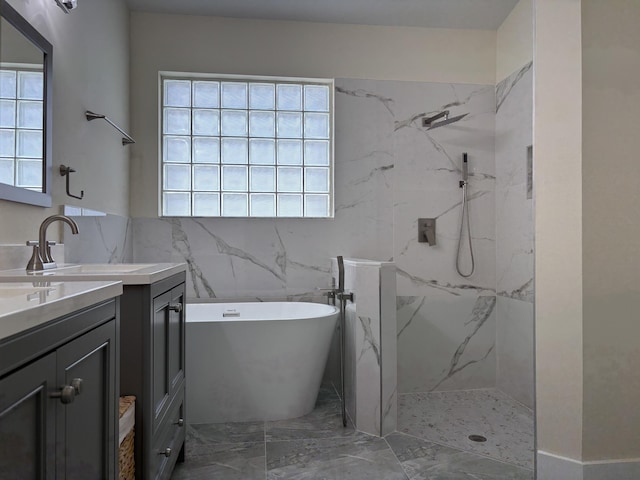 bathroom with vanity and separate shower and tub