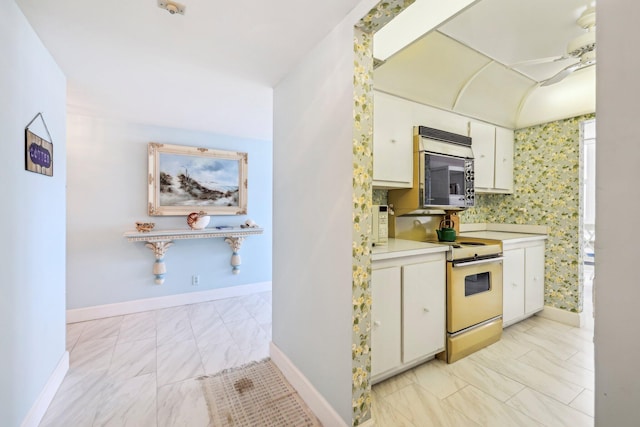 kitchen with white cabinetry and stove