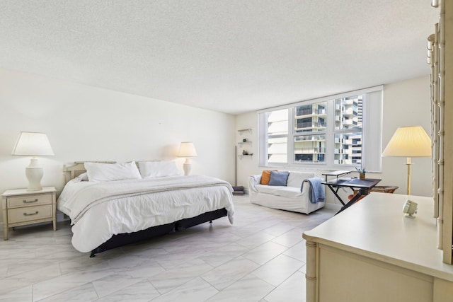 bedroom featuring a textured ceiling