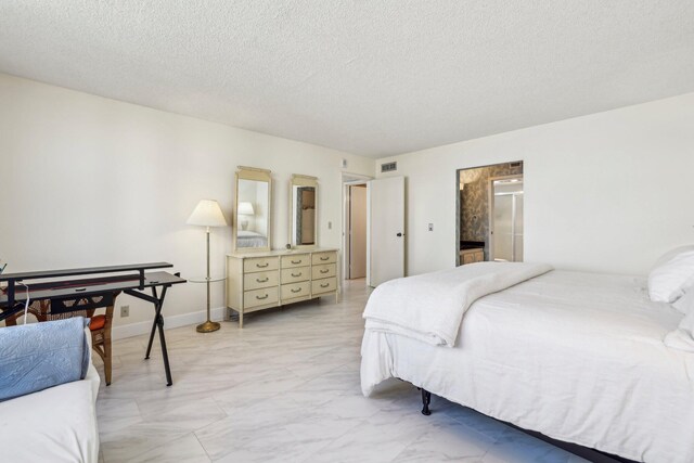 bathroom with vanity, a textured ceiling, a shower with door, and toilet