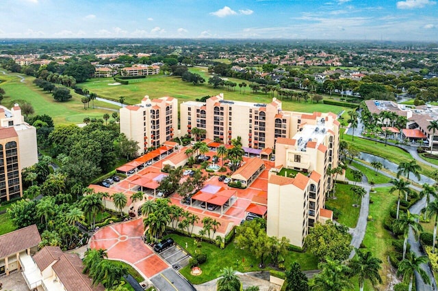 aerial view featuring view of golf course and a water view