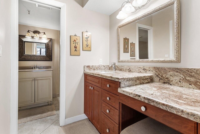 bathroom featuring vanity and tile patterned flooring