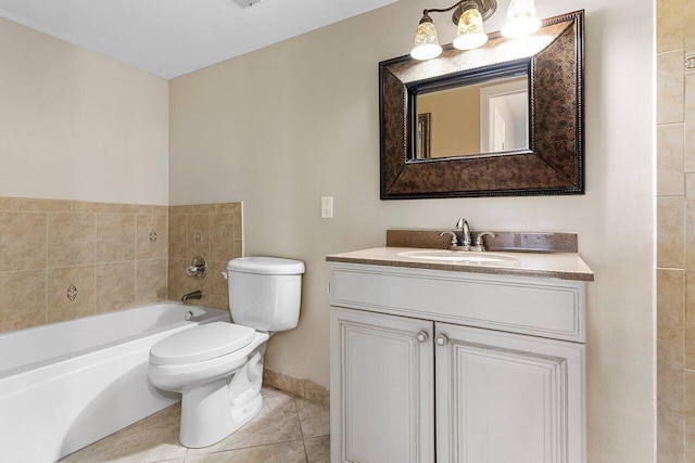 bathroom with toilet, baseboards, tile patterned floors, vanity, and a tub