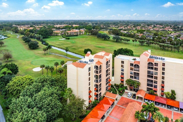 aerial view featuring a water view and view of golf course