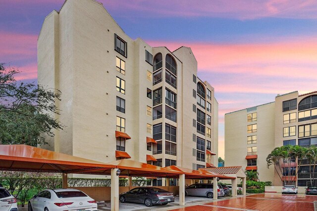 view of outdoor building at dusk