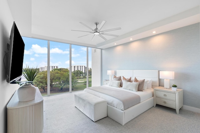 bedroom with recessed lighting, a wall of windows, access to outside, baseboards, and wallpapered walls