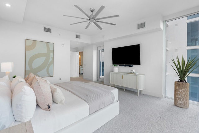 bedroom with carpet floors, visible vents, and ceiling fan