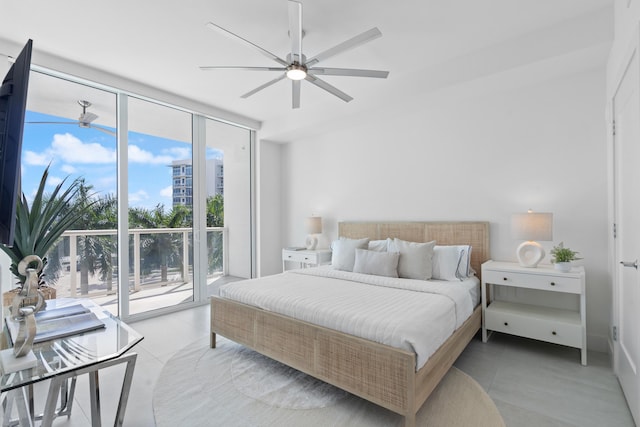 bedroom with light tile patterned floors, access to outside, a wall of windows, and a ceiling fan