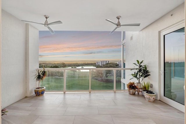 balcony at dusk with ceiling fan