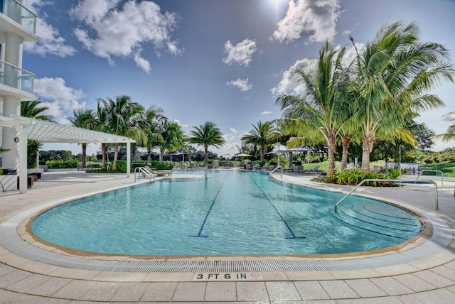 pool featuring a patio area and a pergola