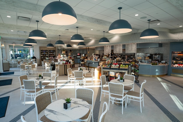 dining area featuring a drop ceiling and recessed lighting