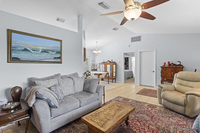 tiled living room with ceiling fan with notable chandelier and vaulted ceiling