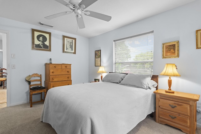 bedroom featuring ceiling fan and light carpet