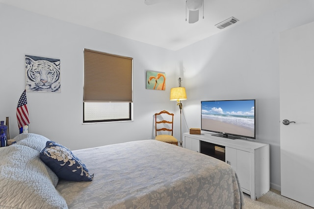 bedroom featuring ceiling fan and light colored carpet