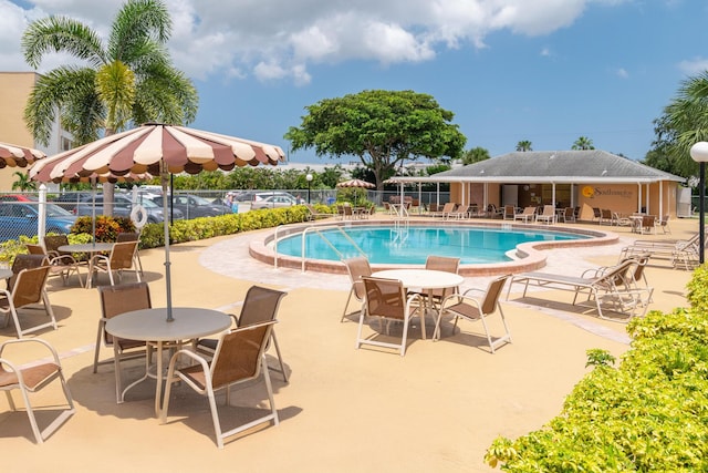 view of swimming pool featuring a patio area