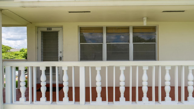 view of exterior entry featuring a porch