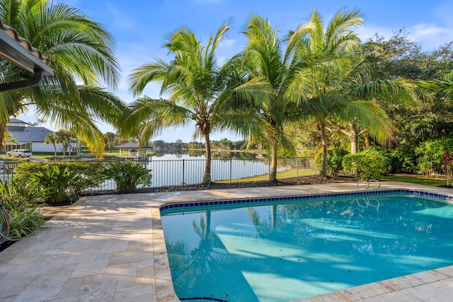 view of pool with a water view