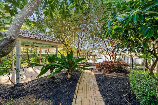 view of yard featuring ceiling fan and a patio area