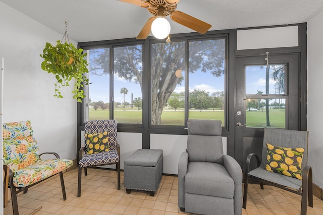 sunroom / solarium with ceiling fan