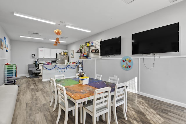 dining area with hardwood / wood-style flooring