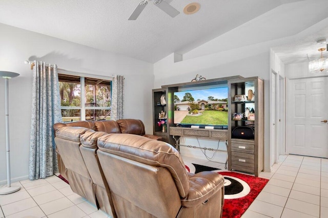 living room featuring lofted ceiling, light tile patterned floors, a textured ceiling, and ceiling fan