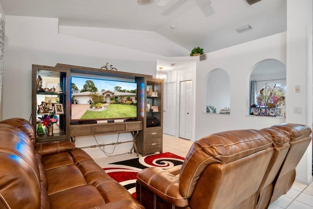 tiled cinema with lofted ceiling and ceiling fan