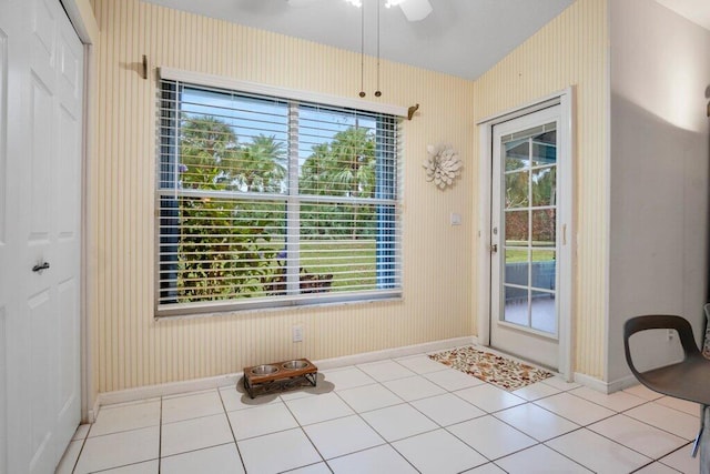 entryway featuring plenty of natural light, light tile patterned floors, and ceiling fan