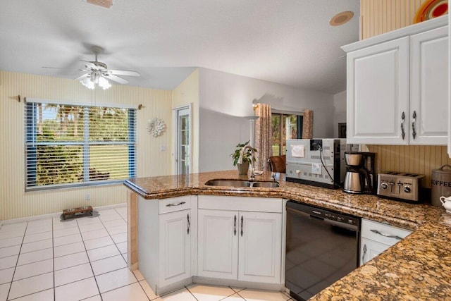 kitchen featuring light tile patterned flooring, sink, black dishwasher, kitchen peninsula, and white cabinets