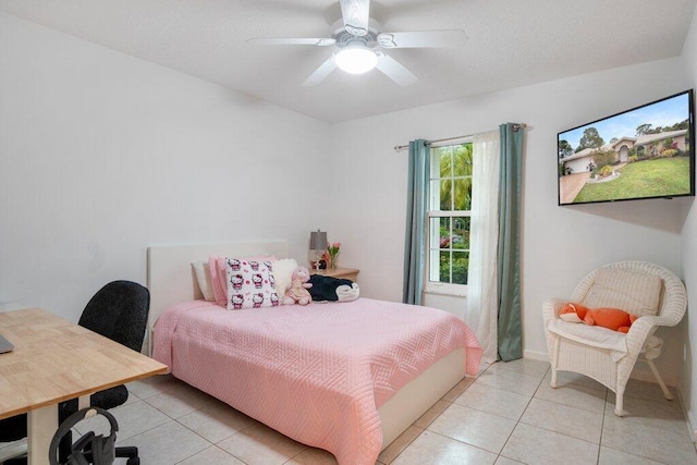 tiled bedroom featuring ceiling fan