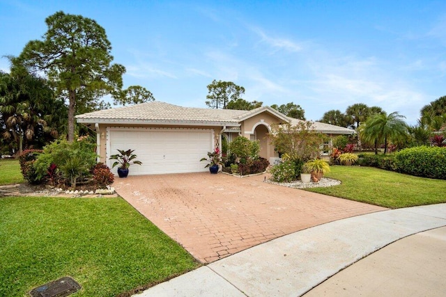 single story home featuring a garage and a front yard