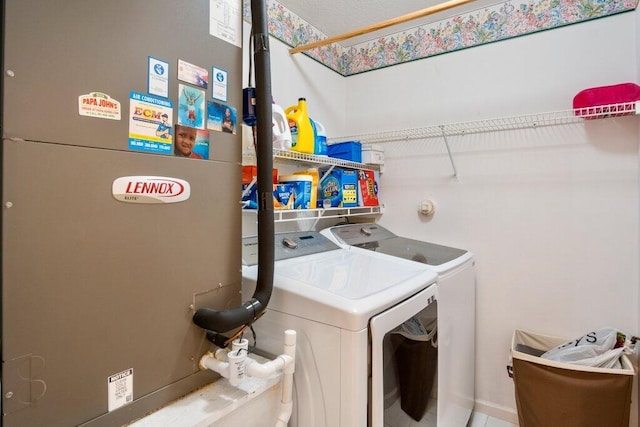 washroom with heating unit and washing machine and dryer