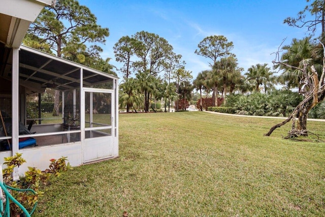 view of yard featuring a sunroom