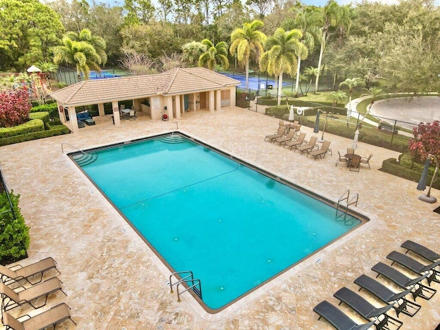 view of swimming pool with a patio area