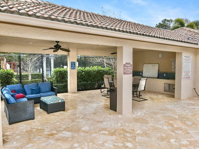 view of patio featuring outdoor lounge area and ceiling fan